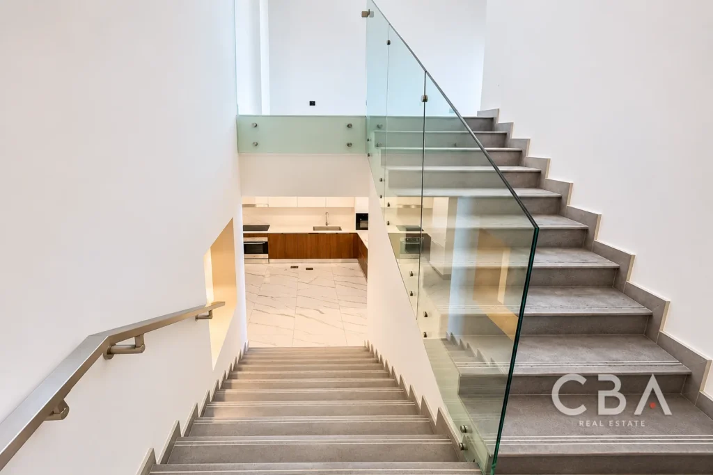 Modern Stairwell Overlooking Contemporary Kitchen
